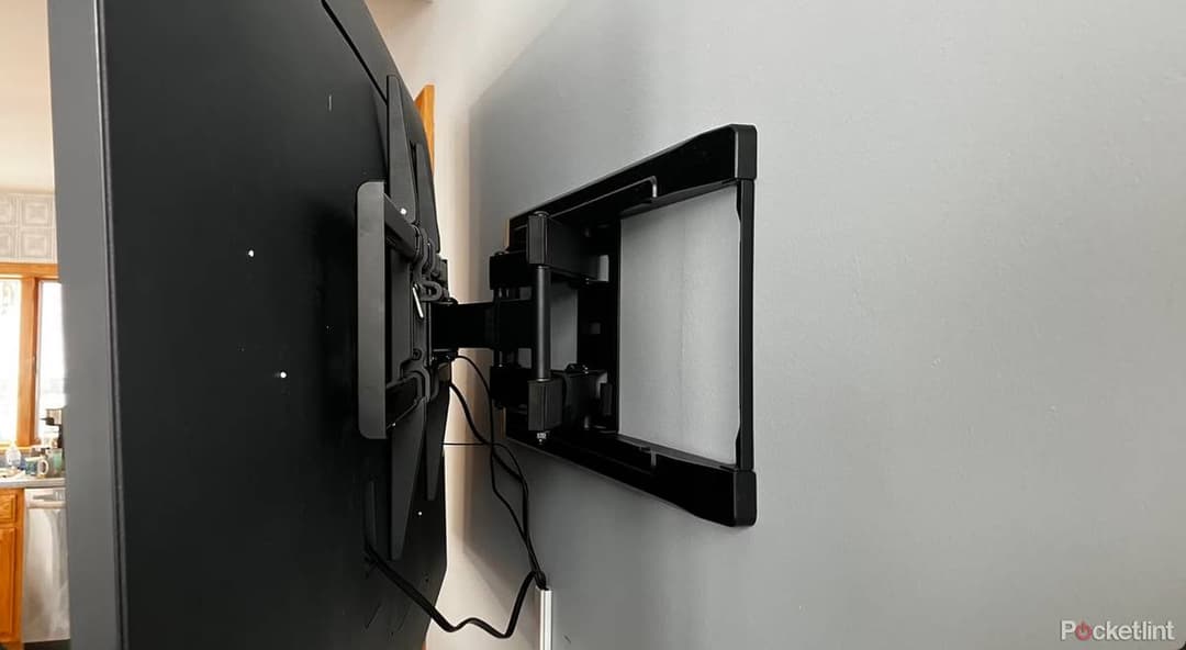 Wall-mounted TV bracket installation with concealed wiring