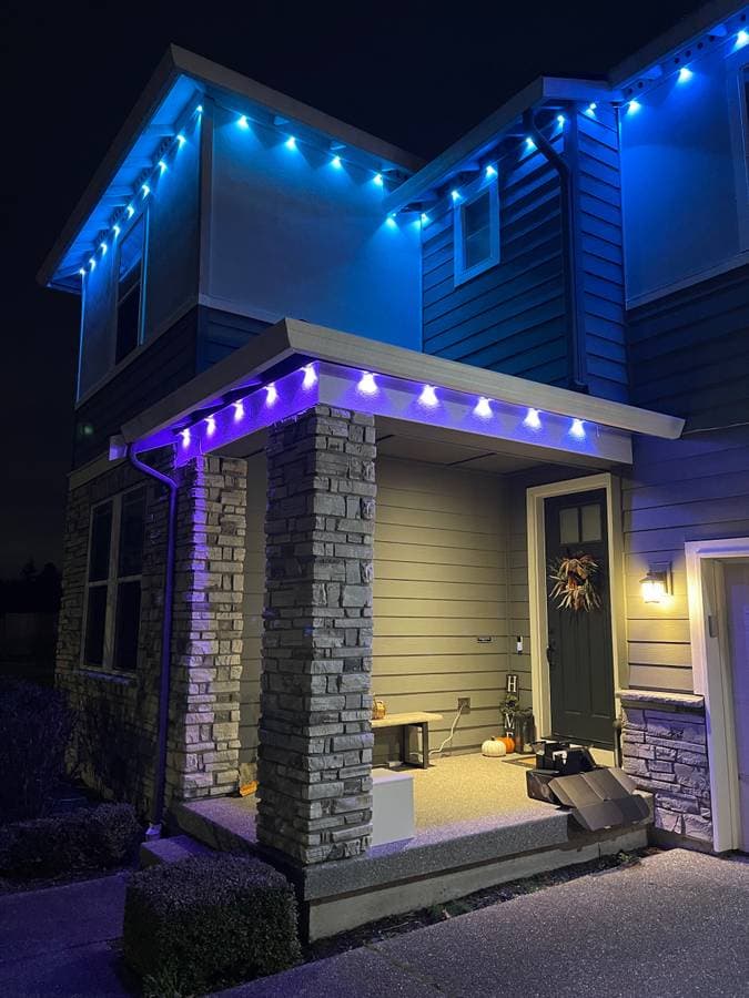 Exterior lighting installation highlighting roofline with LED accent lights